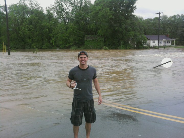 Matthew stands near the flooding off of Concord Road