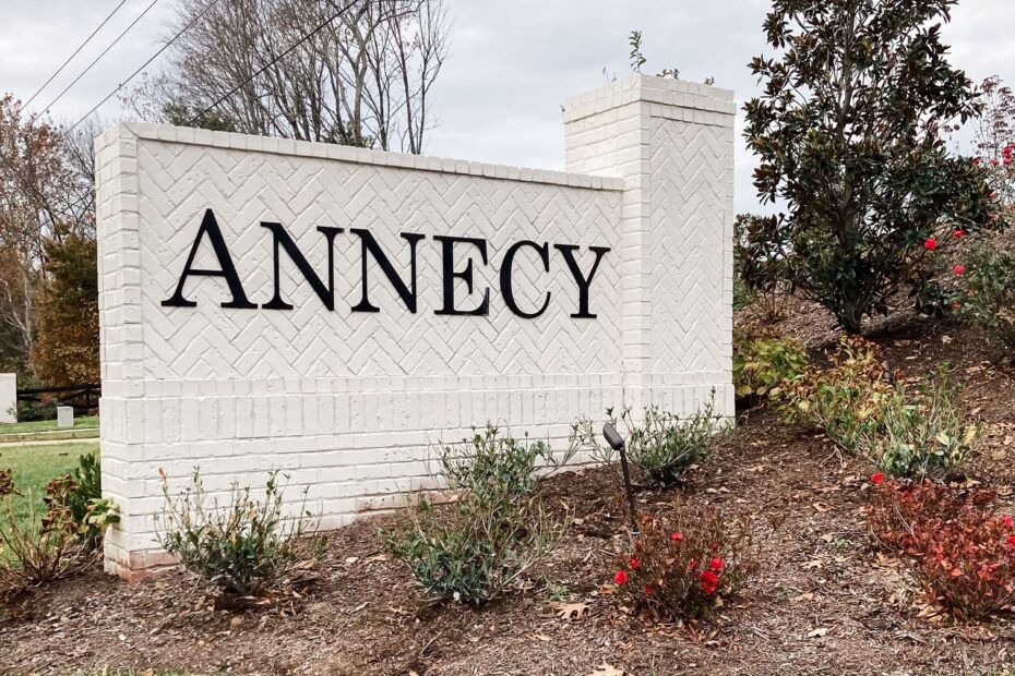 A sign greets guests and residents at the York Road entrance of Annecy in Nolensville, TN